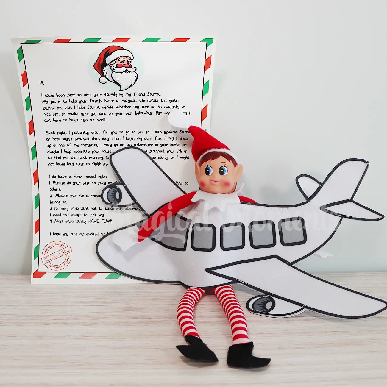 elf arrival letter next to an elf wearing an Aeroplane costume