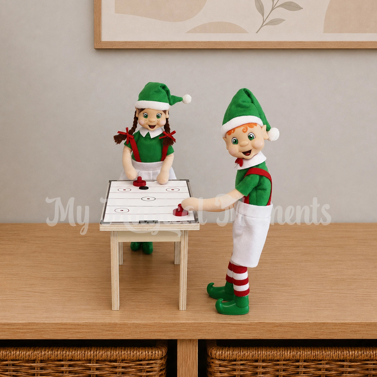 Elves playing with a mini air hockey scene