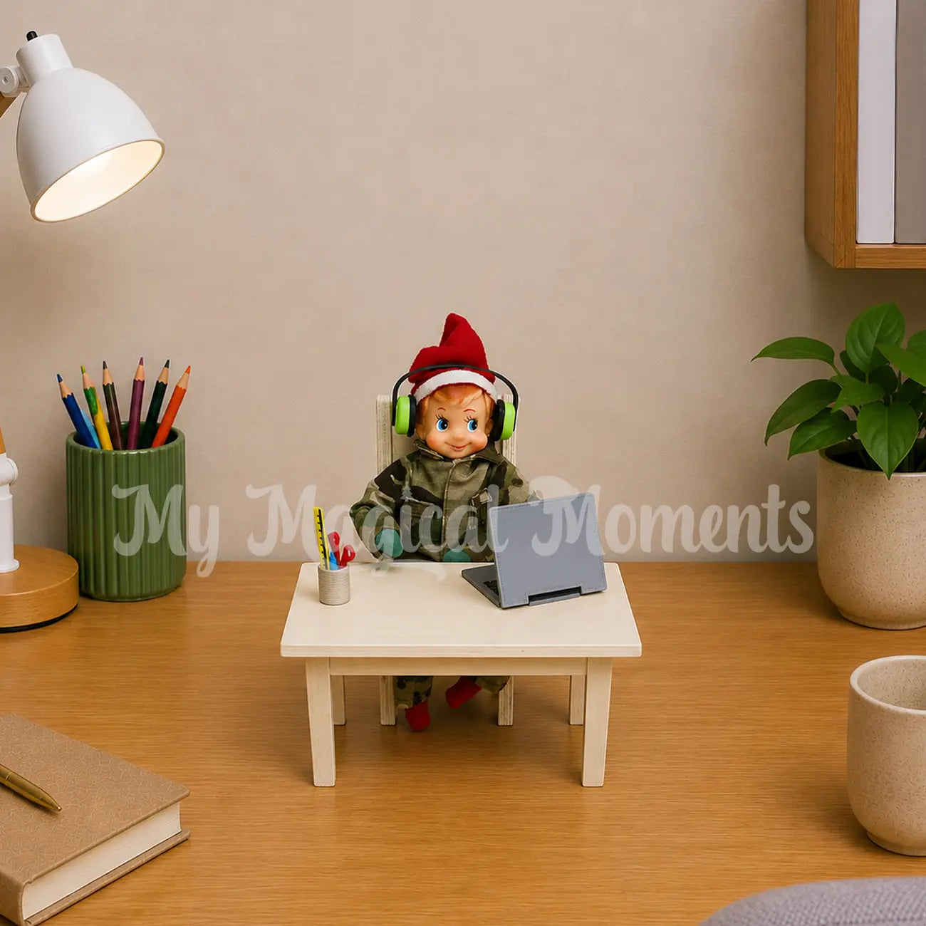 Elf wearing headphones dressed in an army uniform working on a laptop on a mini table