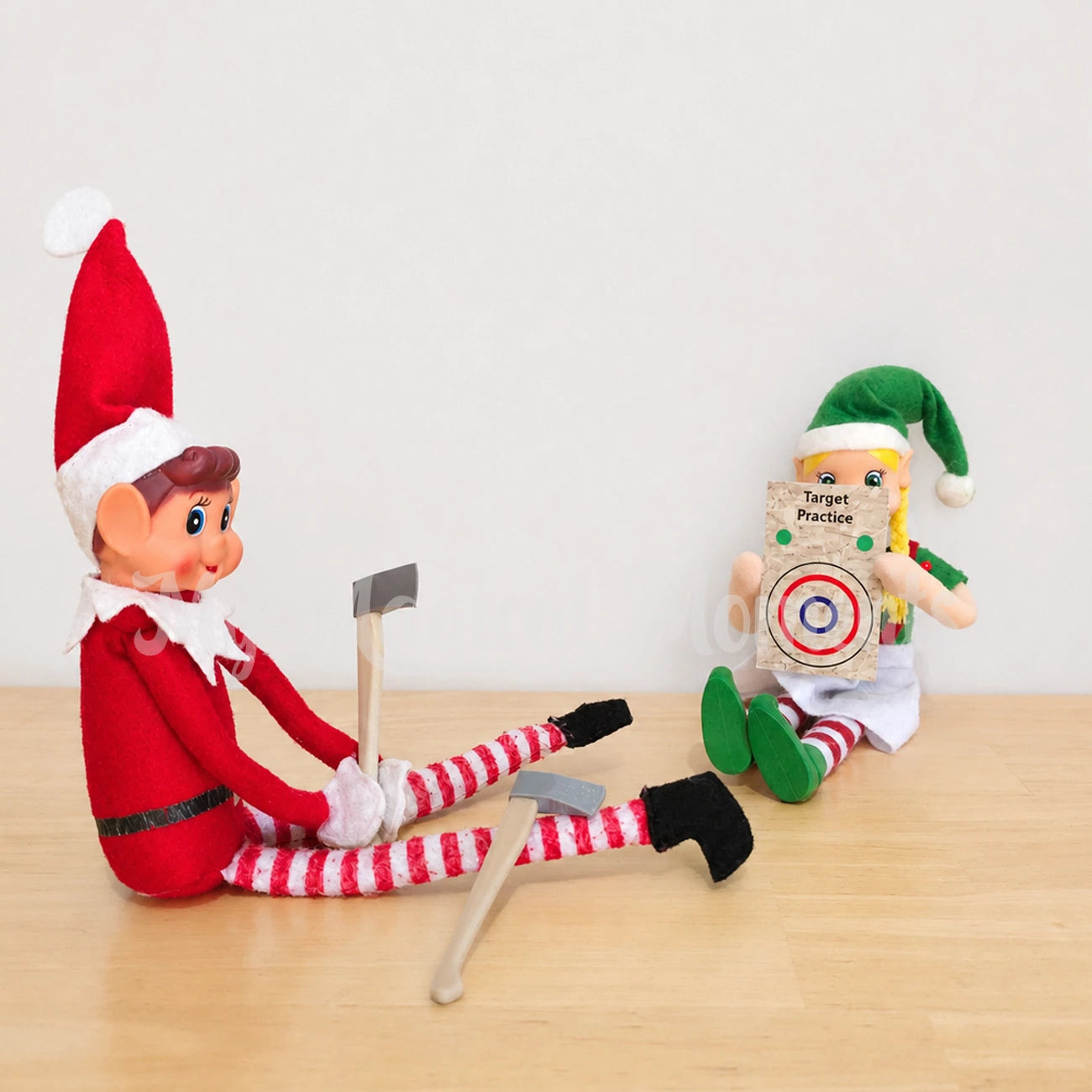 Elves playing target practice with an axe