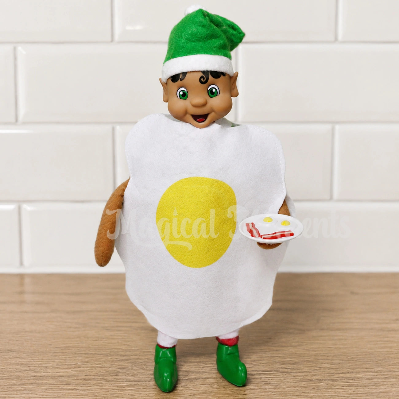 Elf holding bacon and eggs dressed as an egg