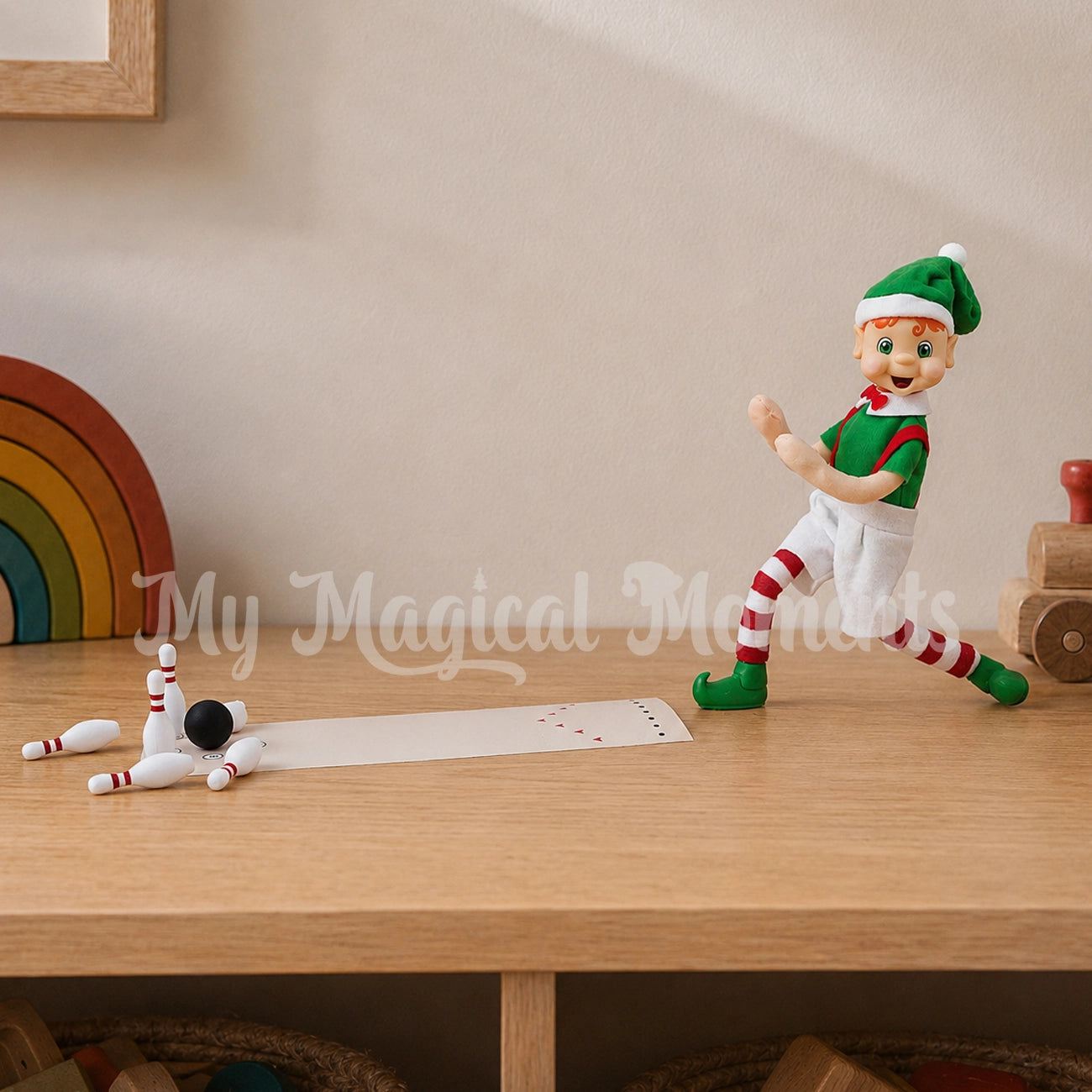 Elf bowling pins down with miniature bowling pins and ball