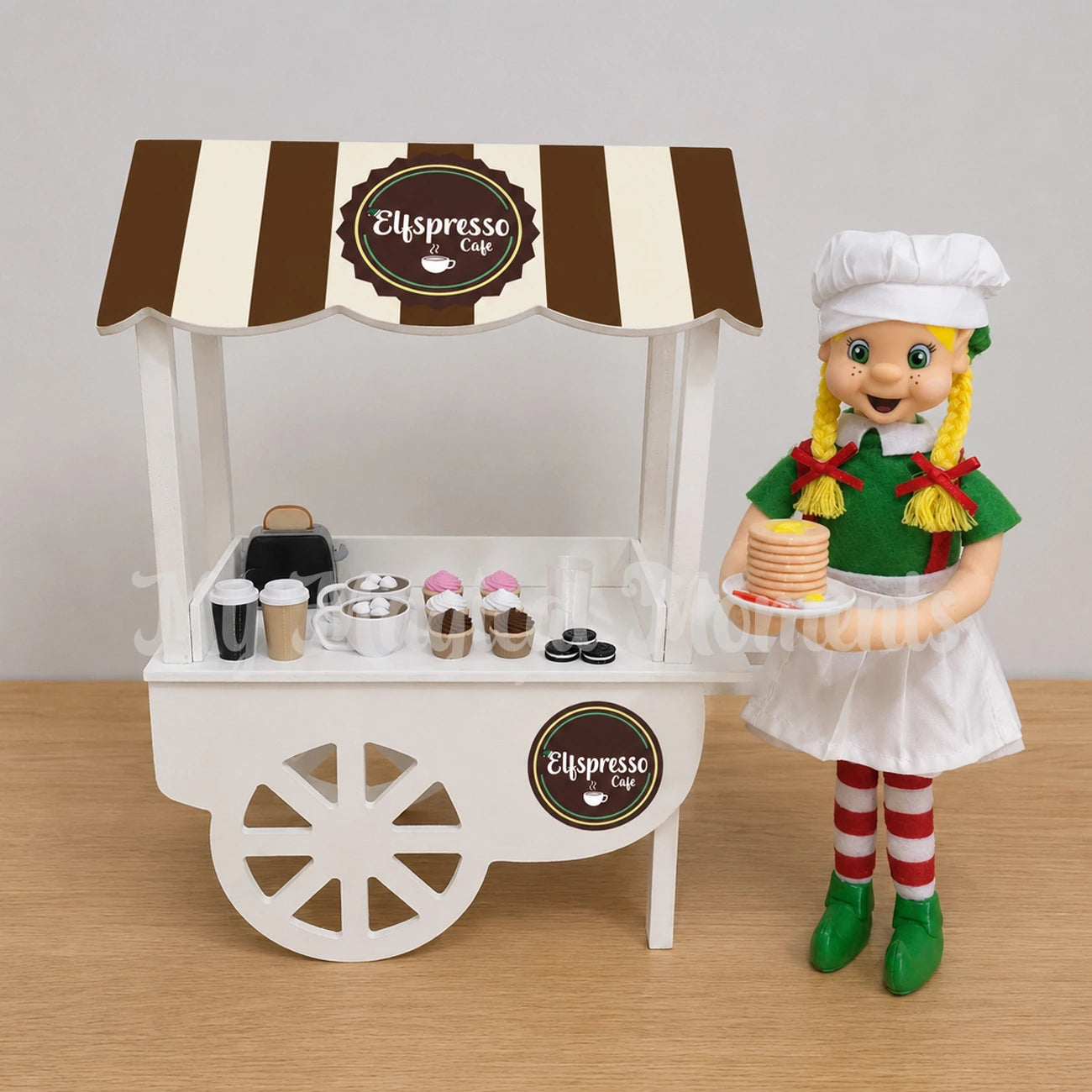Elf selling pancakes, hot cocoa , donuts and cupcakes at a cafe