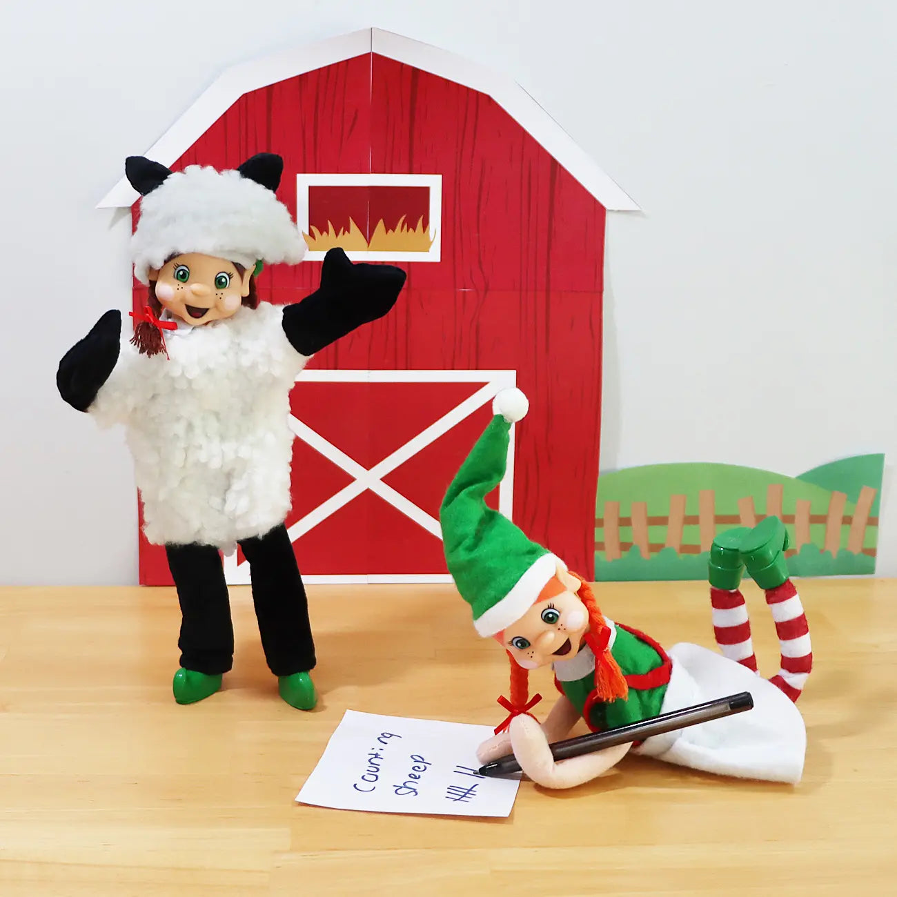 Brown Hair elf friends wearing a sheep costume with an orange hair elf counting sheep in front of a printable barn