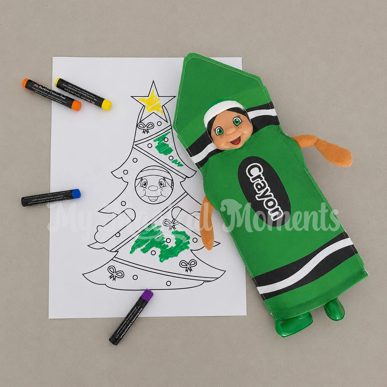 Black hair elf dressed as a green crayon colouring her self with crayons