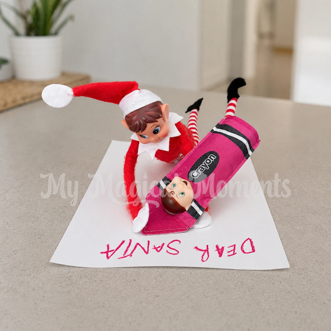 Elves behavin badly elf writing a letter to santa with a elf toddler dressed as a purple crayon