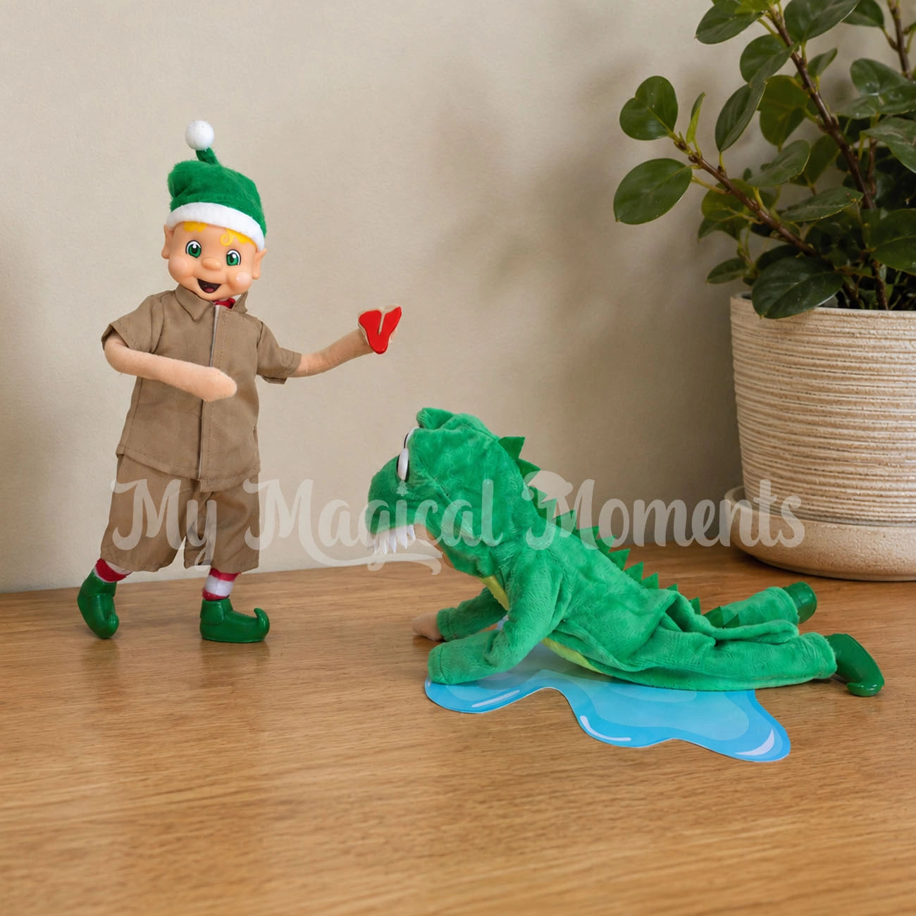 Steve irwn inspired elf dressed as a croc hunter feeding a crocodile elf miniature steak