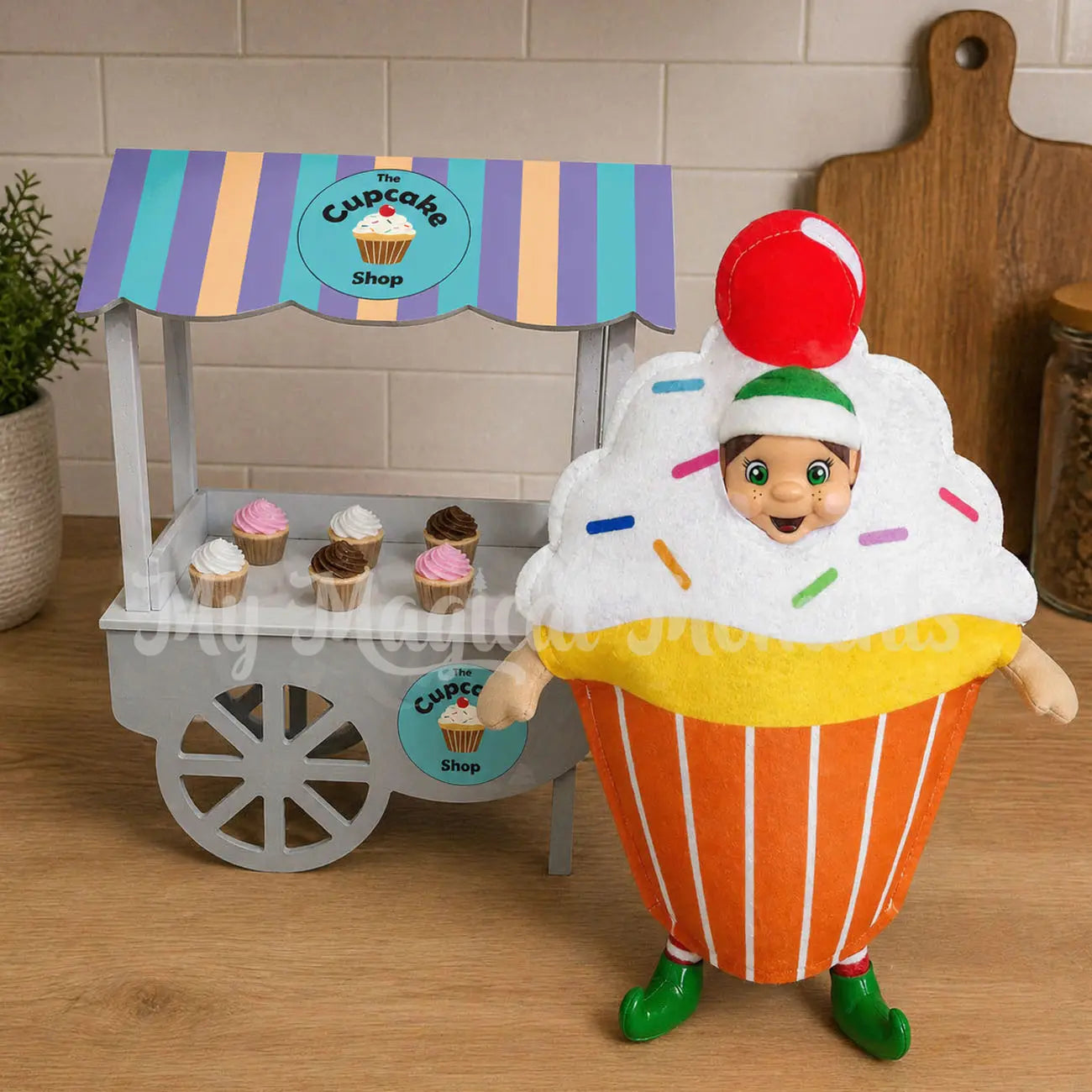 Elf dressed as a cupcake selling miniature cupcakes at her shop