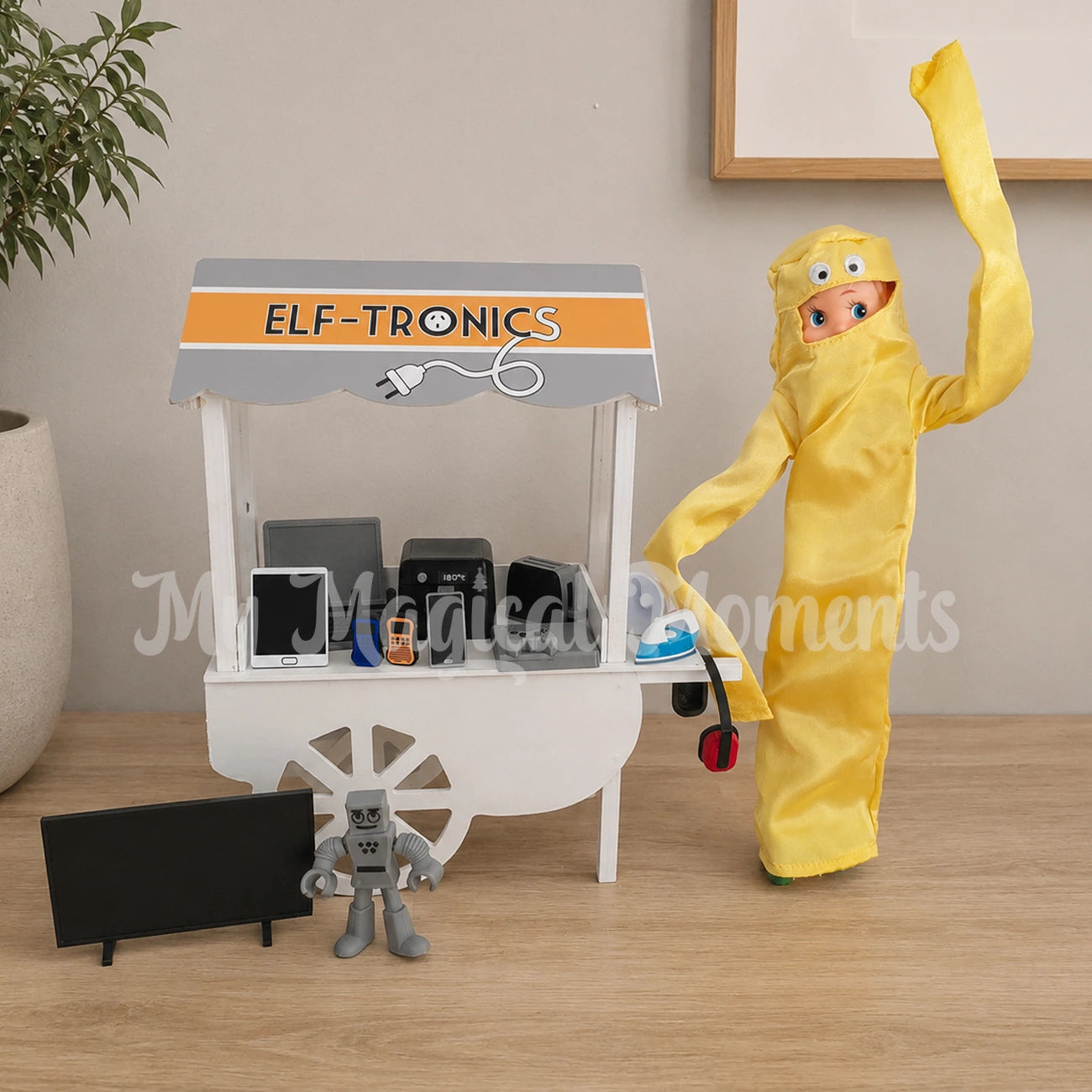 Elf dressed as a wacky inflatable arm waving salesman selling electrical goods