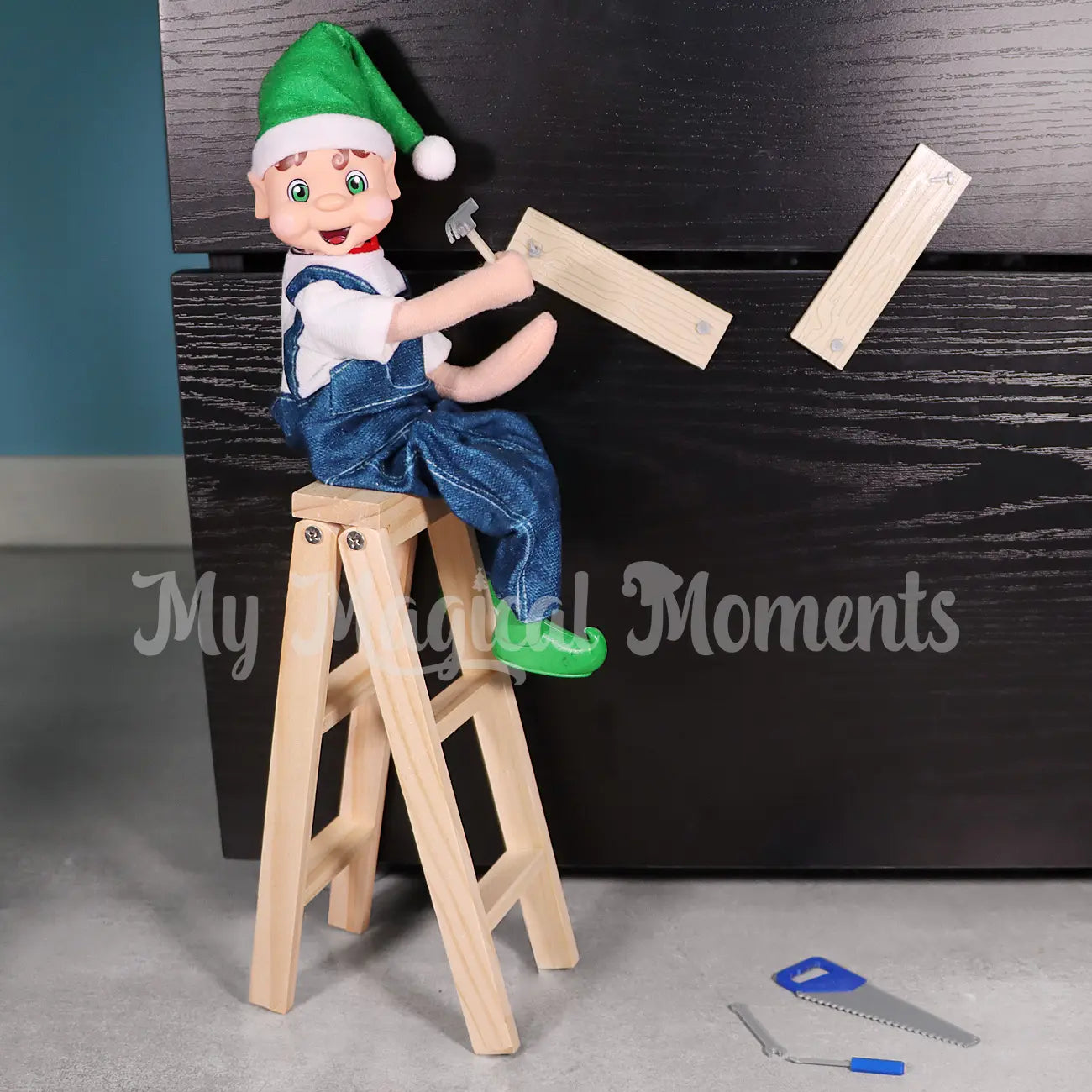 My Elf Friends with Brown Hair Elf Sitting on a ladder hammering wood to a cabinet