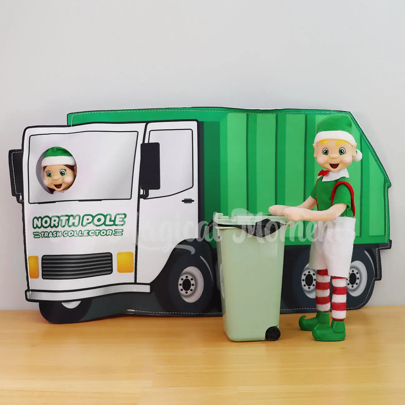 Elf Holding a Bin taking out rubbish with an elf wearing a garbage truck costume