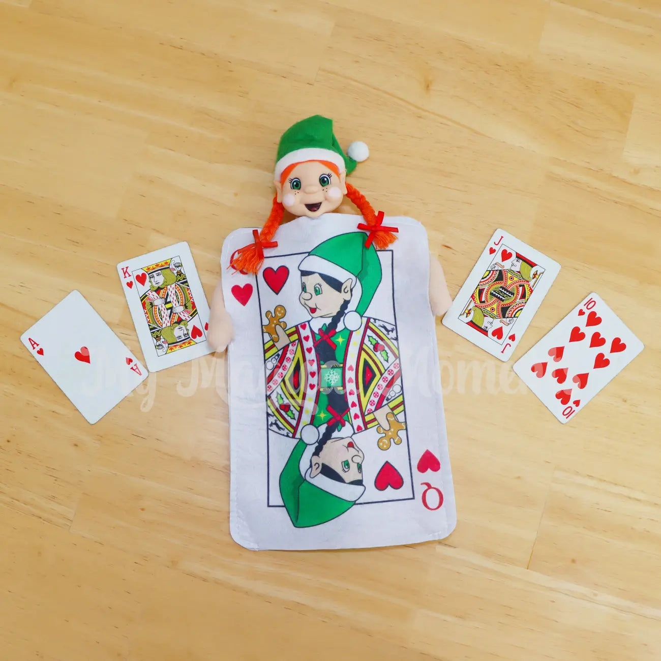 Elf wearing a card queen of hearts costume royal flush