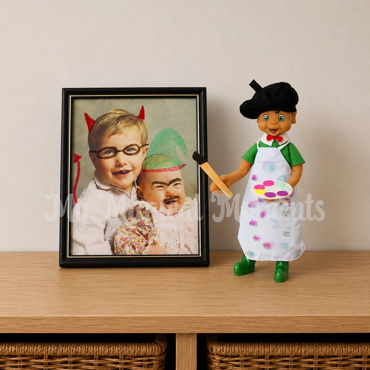 elf wearing an artist frock, holding a mini paintbrush drawing on photos