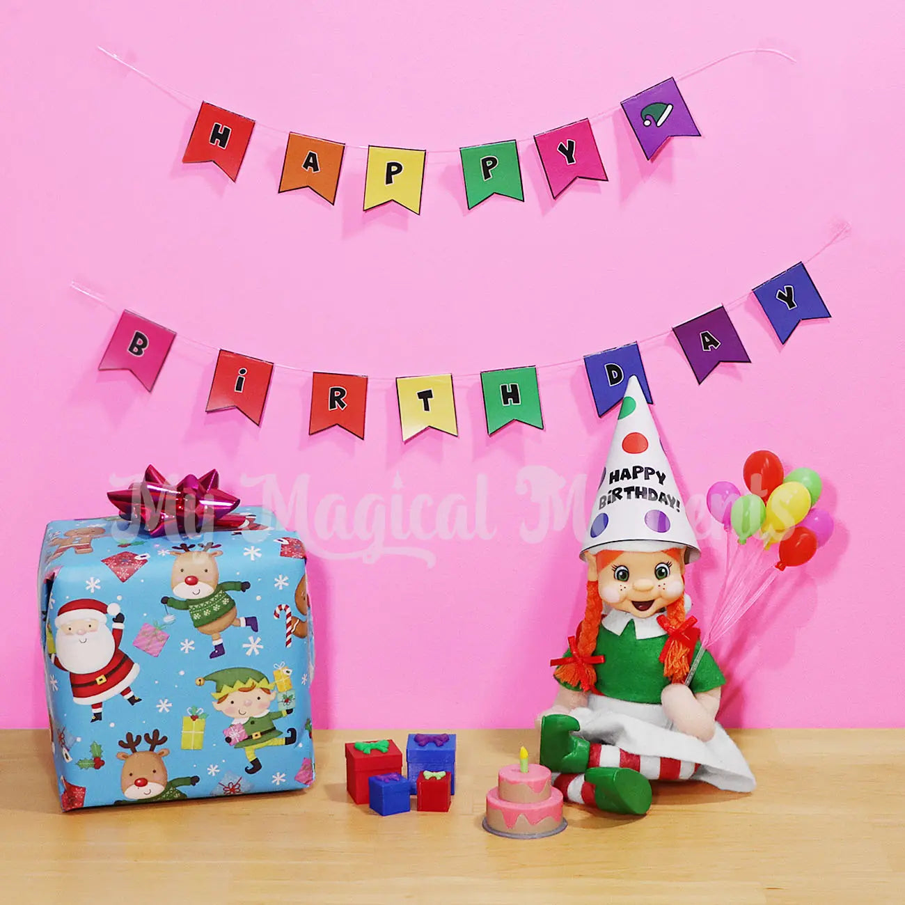 Orange hair My Elf Friends Bendable elf wearing a party hat, a bunch of balloons and a mini strawberry birthday cake. Tiny Presents and a birthday banner