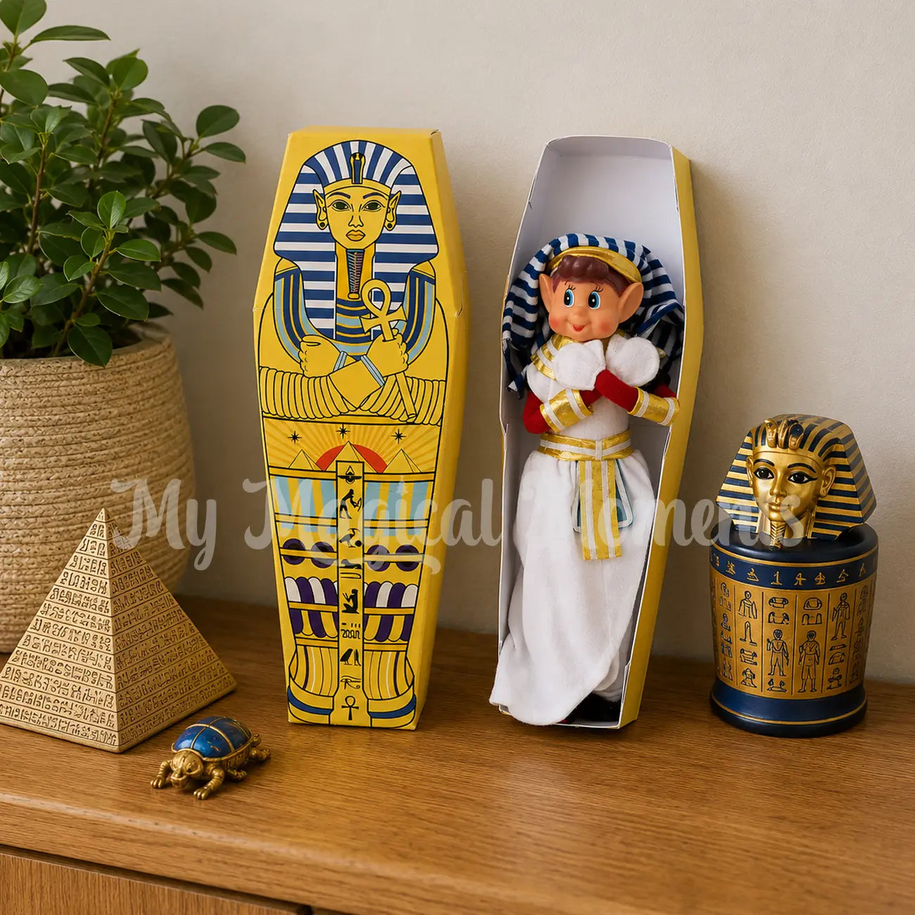 Elf dressed as a pharaoh in a printable elf sarcophagus