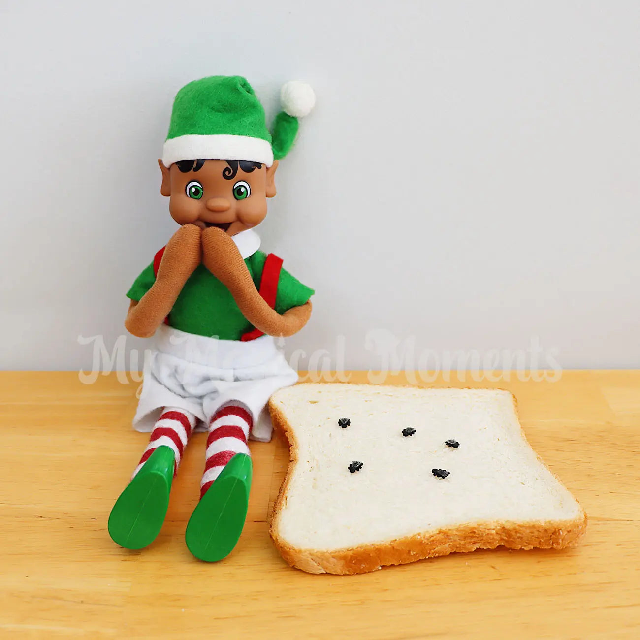 elf pranking with bread covered in flies