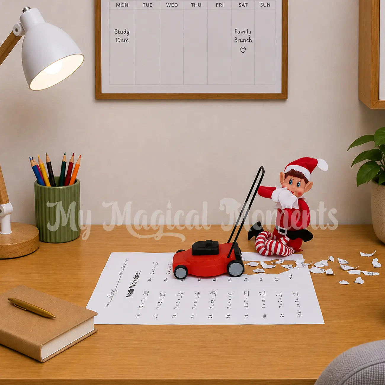 Elf Mowing over kids homework with a elf sized lawn mower prop