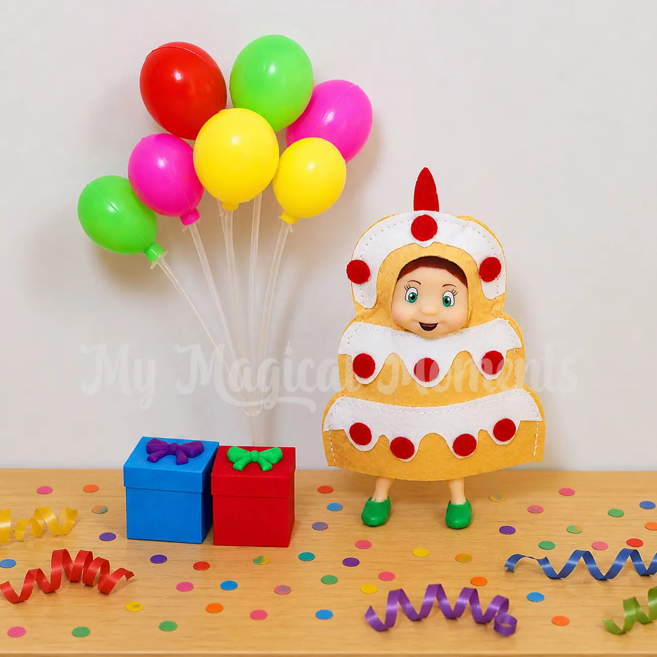 Elf toddler wearing a cake costume, celebrating a party