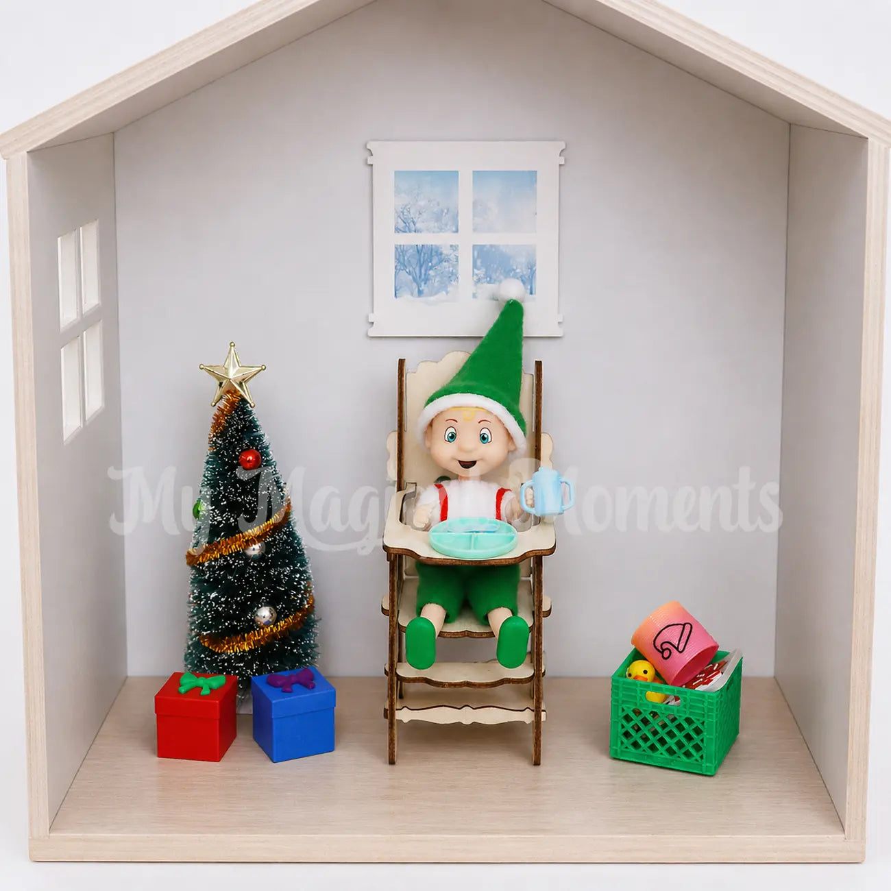 Elf toddler in high chair with sippy cup, plate and mini elf props
