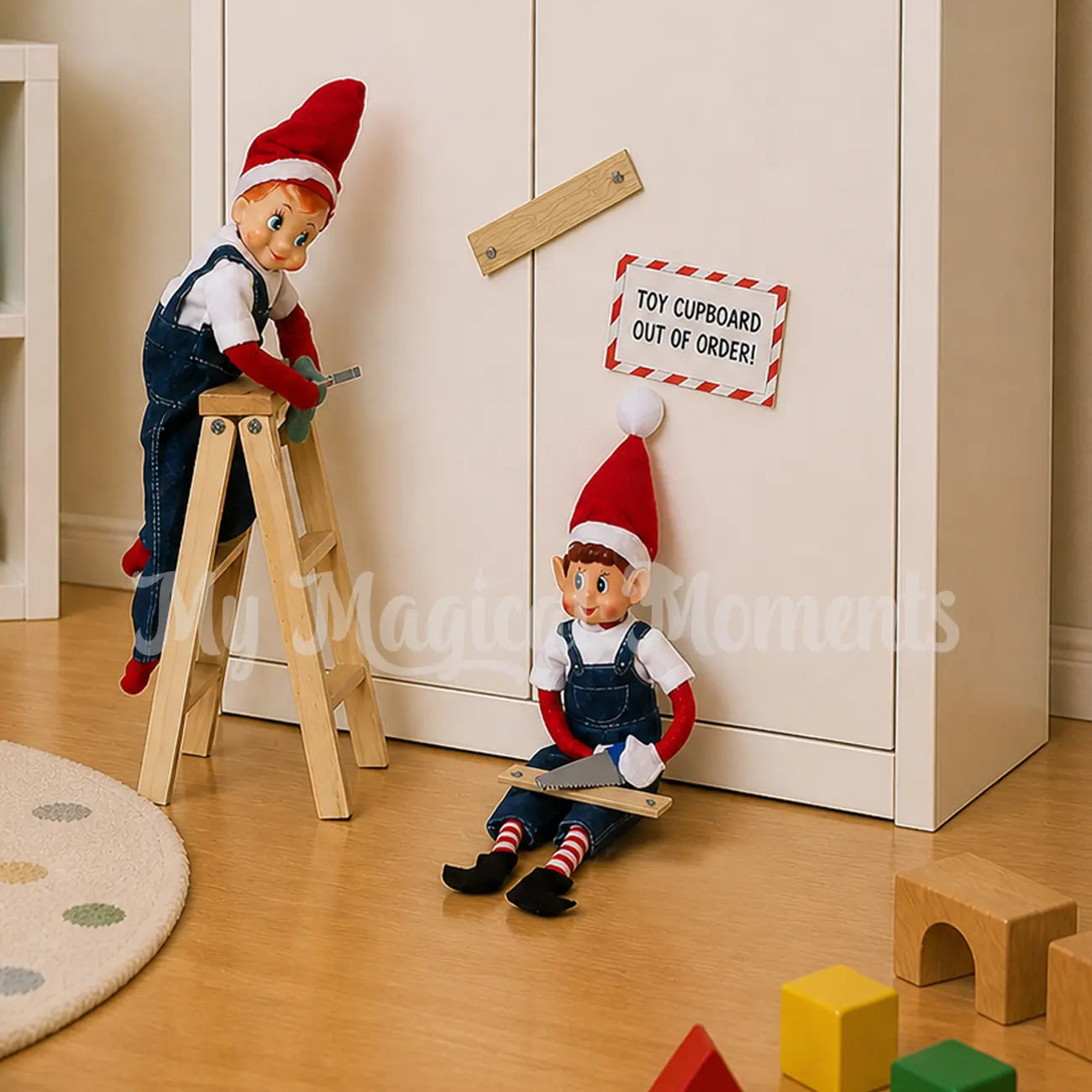 Elves wearing overalls closing up the cupboard with mini planks of wood with a ladder and mini tools
