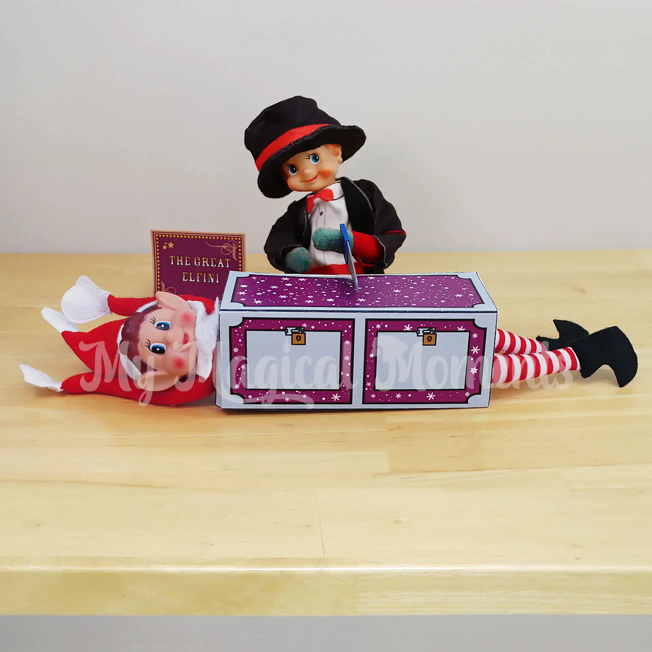 Elf Dressed as a magician sawing elf in half with free printable