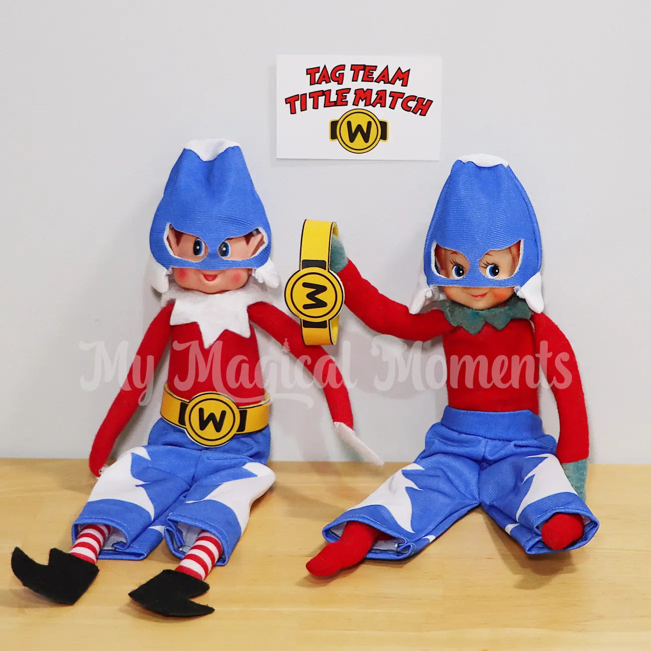 Two Elves wearing Wrestling outfits having a tag team title match