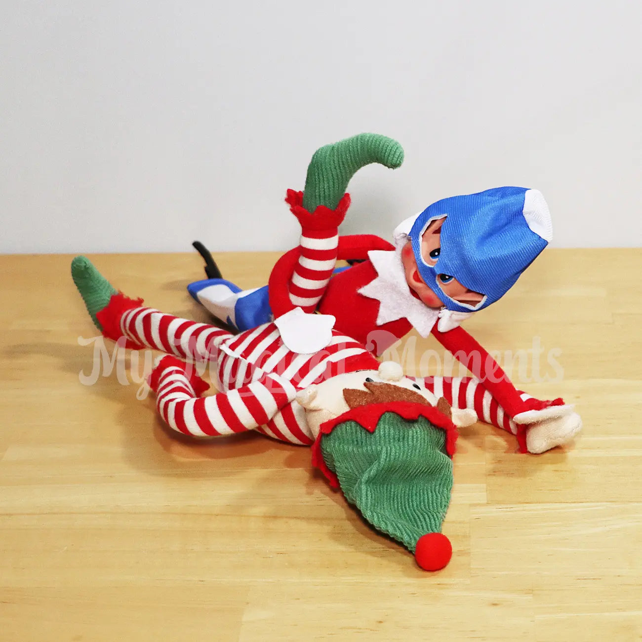 Elves having a wrestling match wearing a WWE outfit