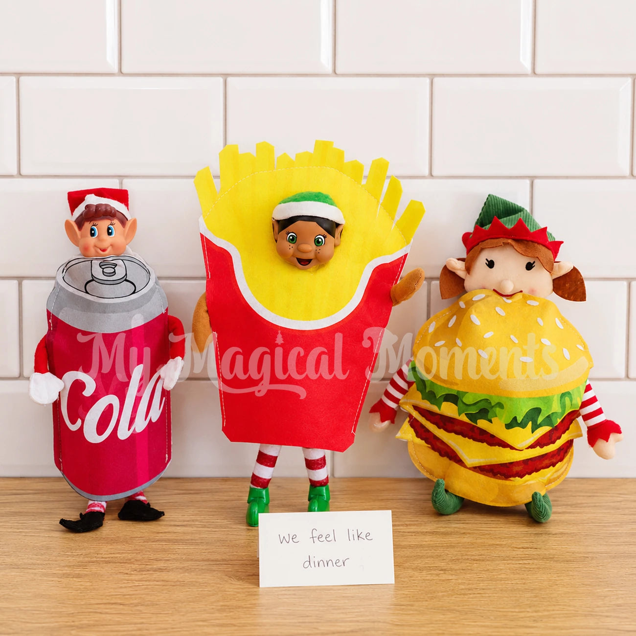 elves dressed up wearing cola costume French fries and a burger costume