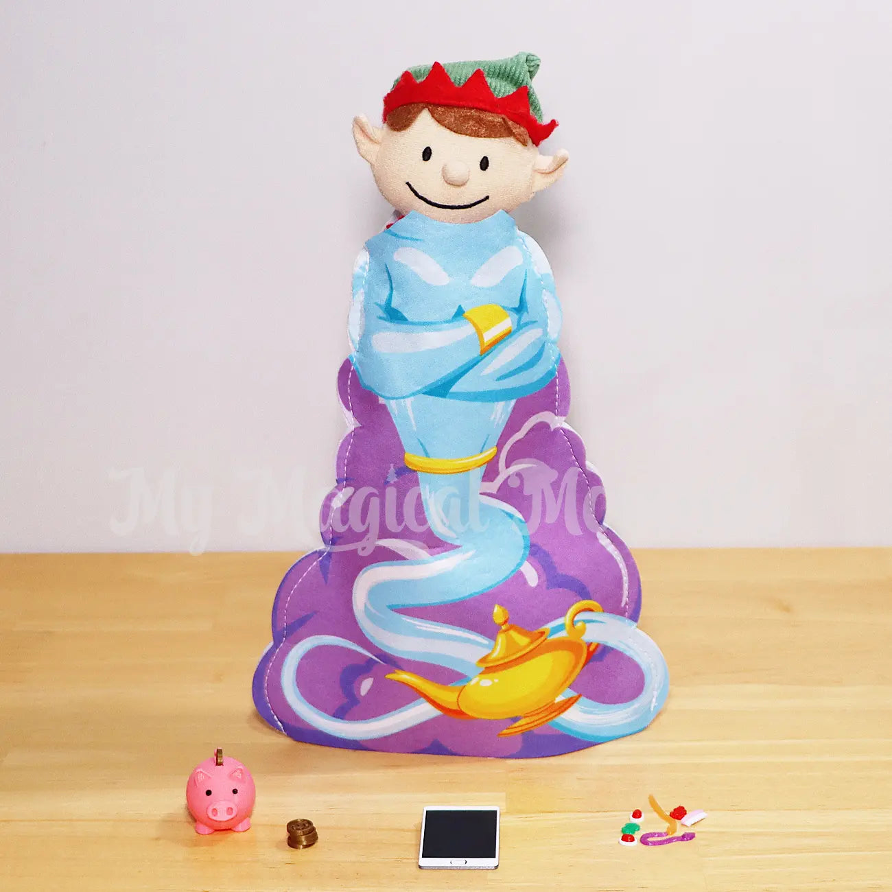 Elf for christmas wearing a genie costume with piggy bank prop, mini elf tablet and miniature allens lollies