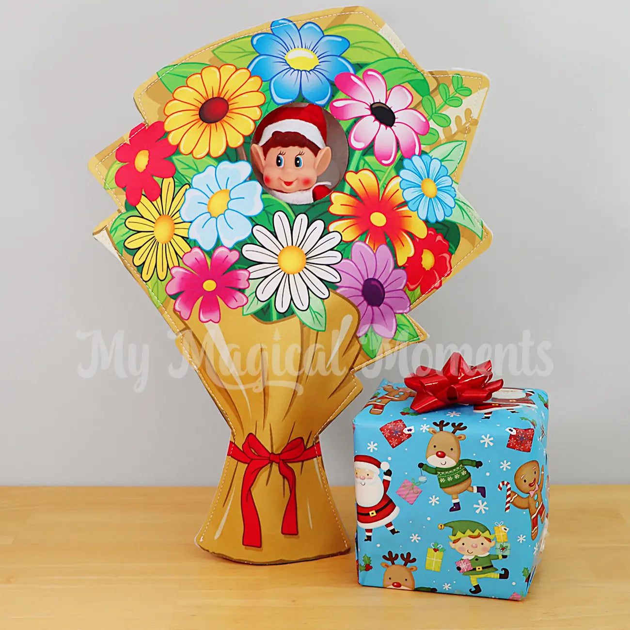 Elves Behavin Badly wearing a colourful bouquet of flowers costume with a present