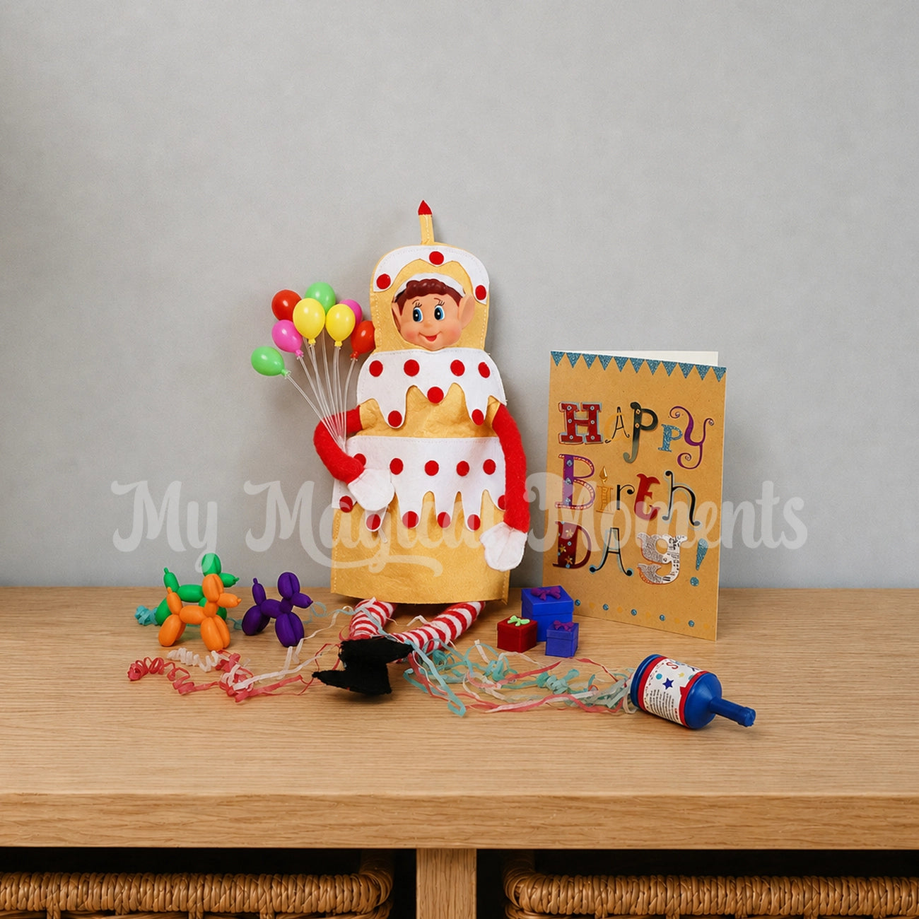 elf wearing a cake costume having a birthday party