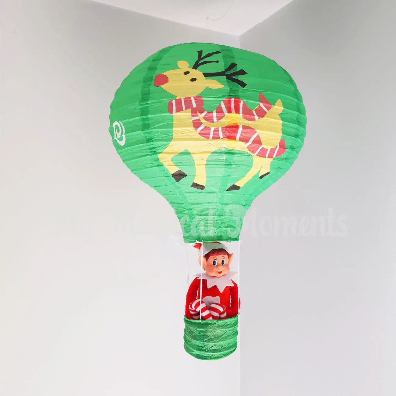 Elves behavin badly sitting in a reindeer hot air balloon