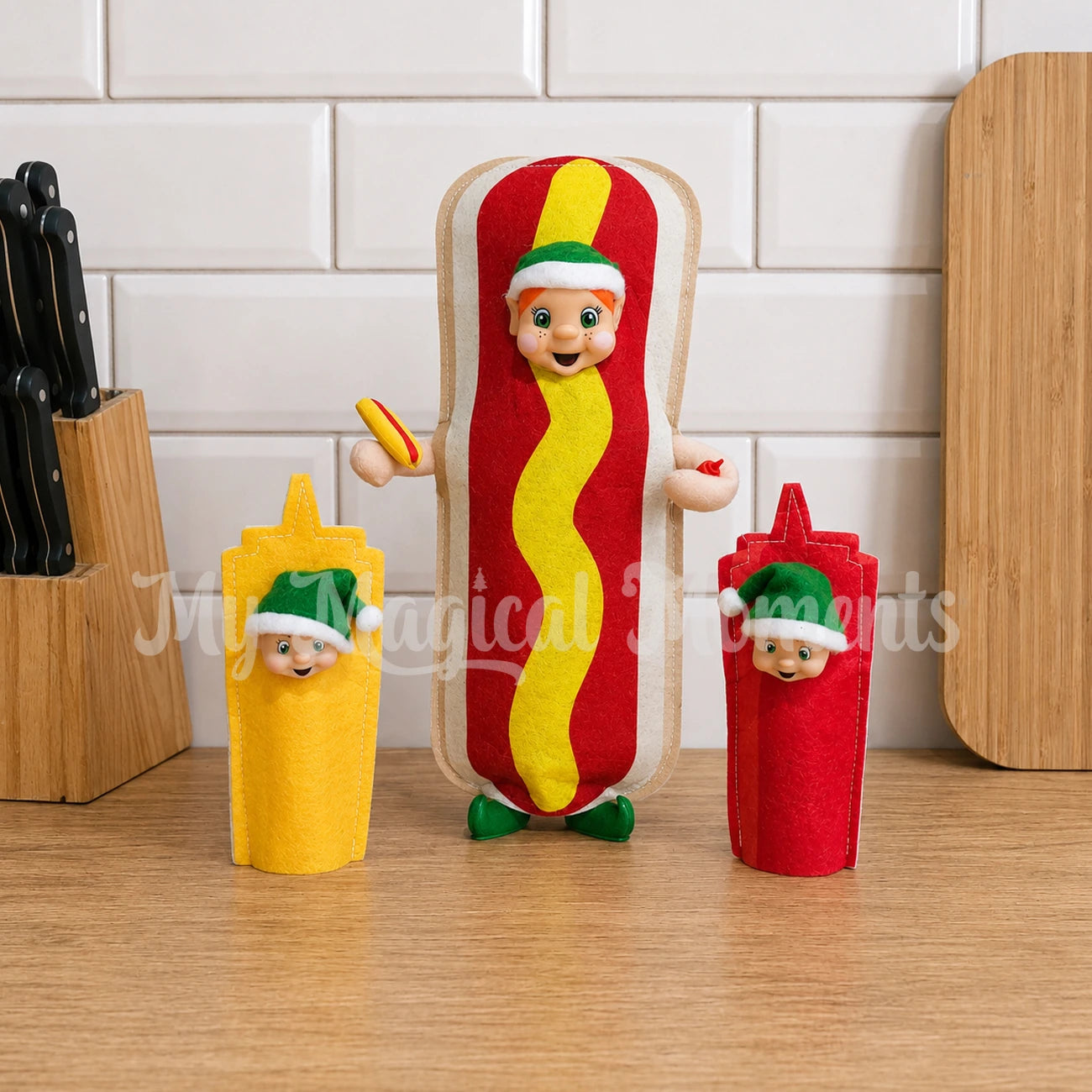 Elf dressed as a hot dog with elf toddlers dressed as tomato sauce and mustard