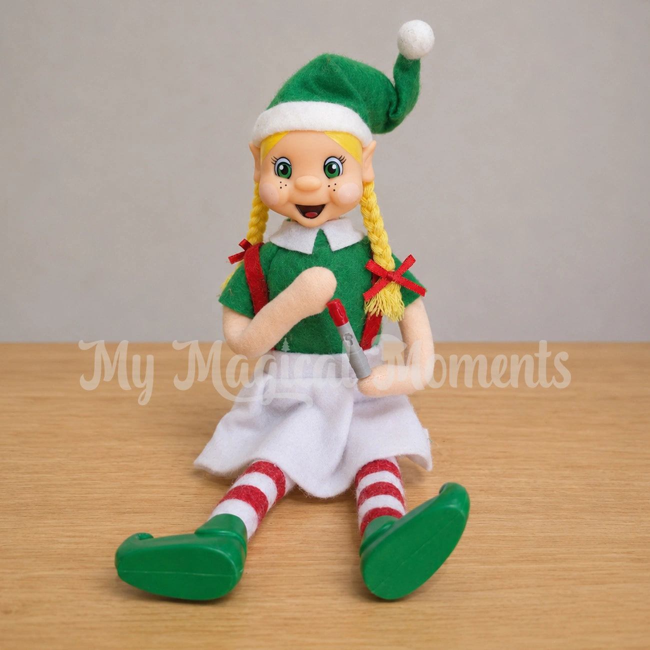 blonde hair Elf holding miniature Humira pen