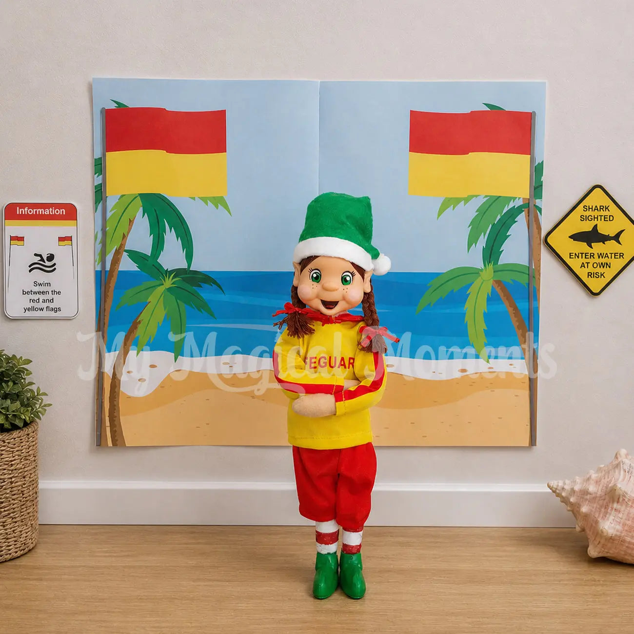 elf dressed as a lifeguard with a beach scene printable and swim between the flags signs.