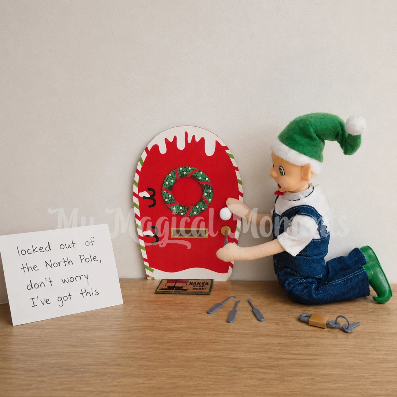 Elf wearing overalls picking a lock on an elf door with a mini elf locking pick. there is a sign that says locked out of the north Pole, don't worry I've got this