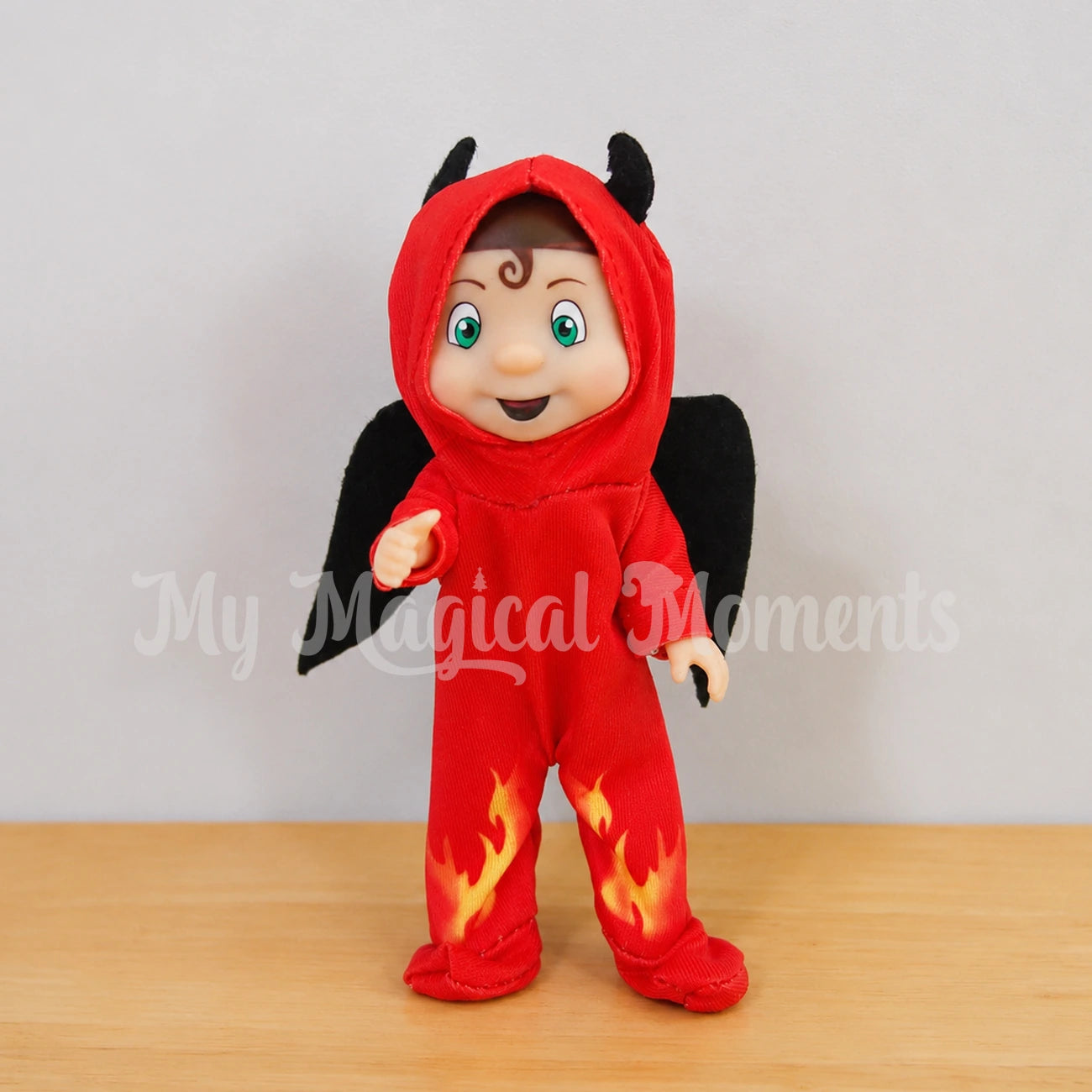 Elf toddler dressed as a devil
