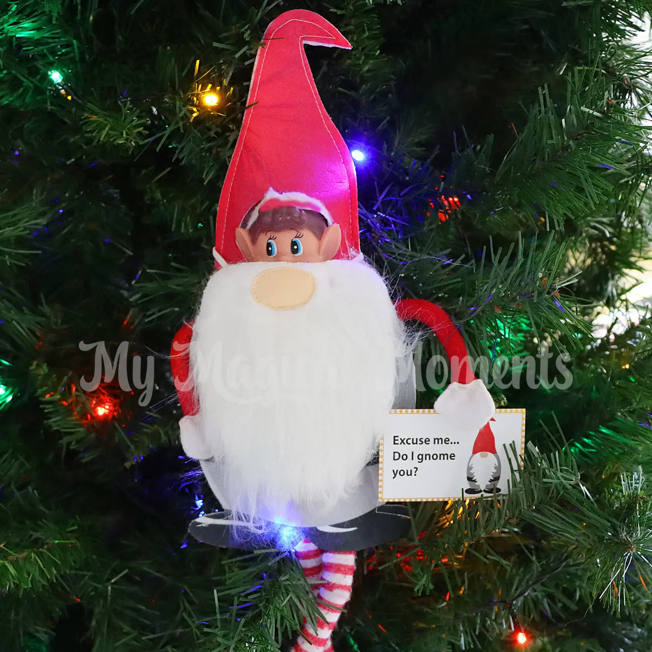 elves behavin badly wearing a santa nordic gnome costume in the tree
