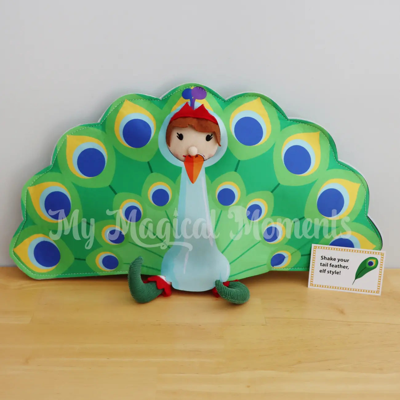 An Elf For Christmas wearing a peacock costume and a shake your tail feather elf style