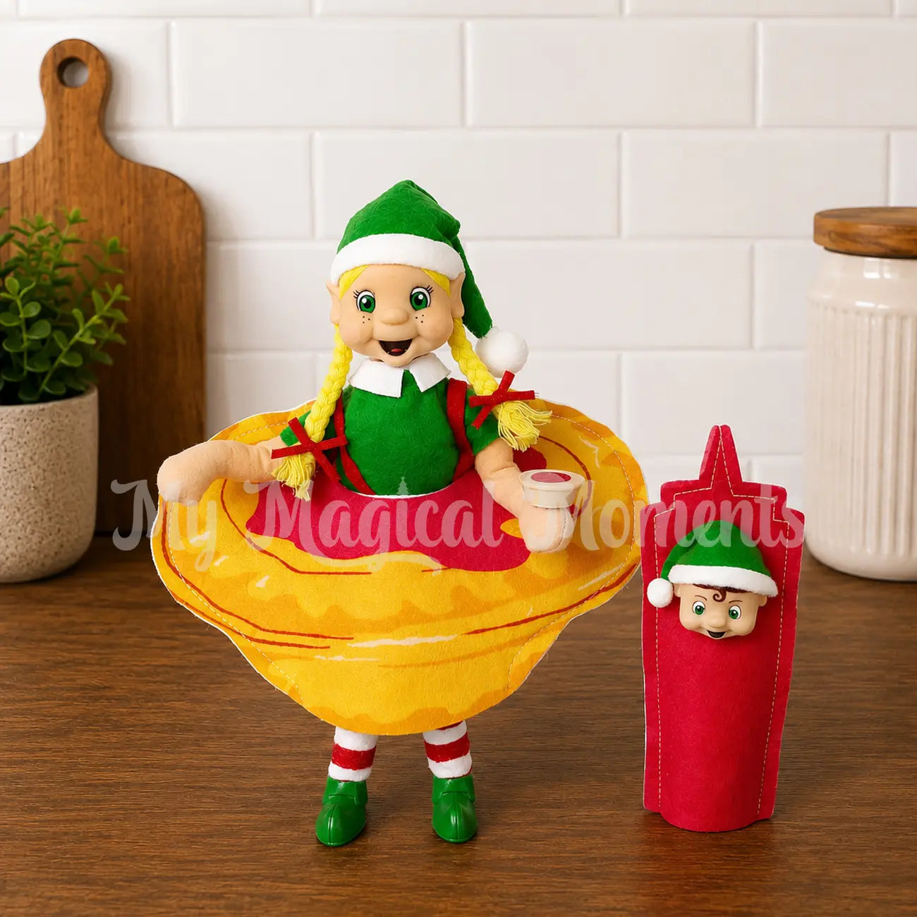 elf wearing a meat pie costume with elf toddler in a ketchup costume