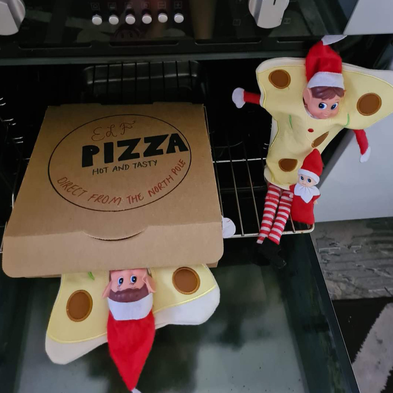 Elf customer pizza scene