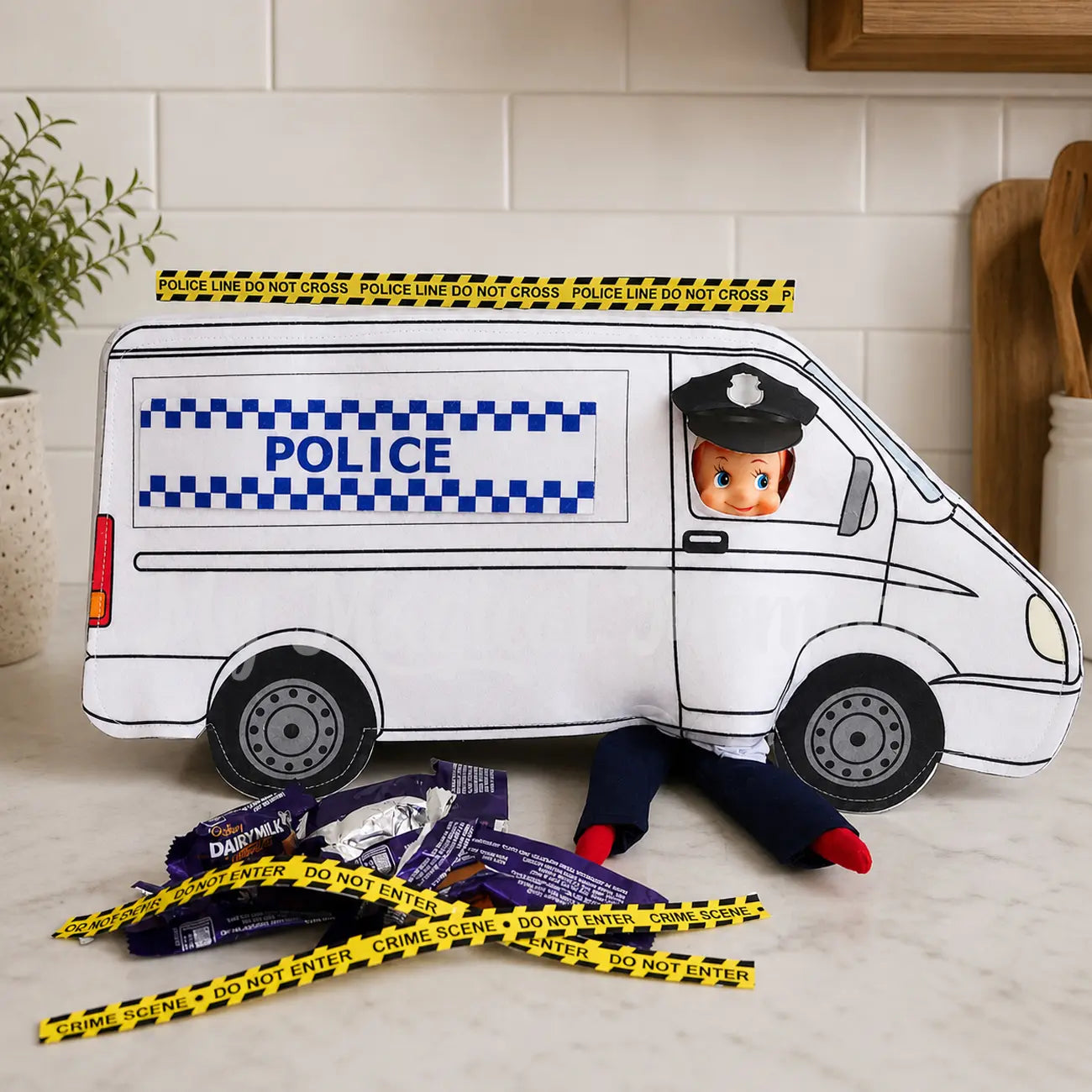 Police Van worn by an elf at a chocolate crime scene