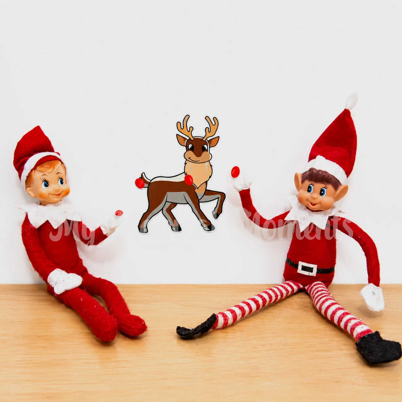 Elves behavin badly and elf shelf playing pin the nose on the reindeer with sticker