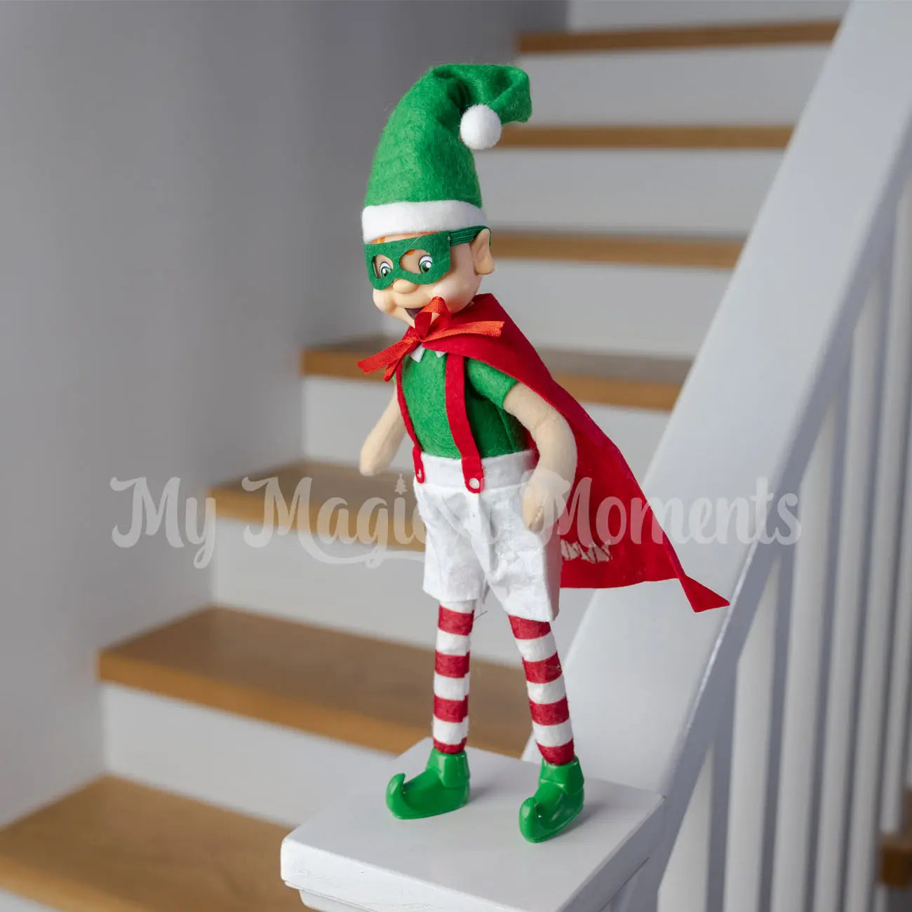 Superhero Elf standing on a banister