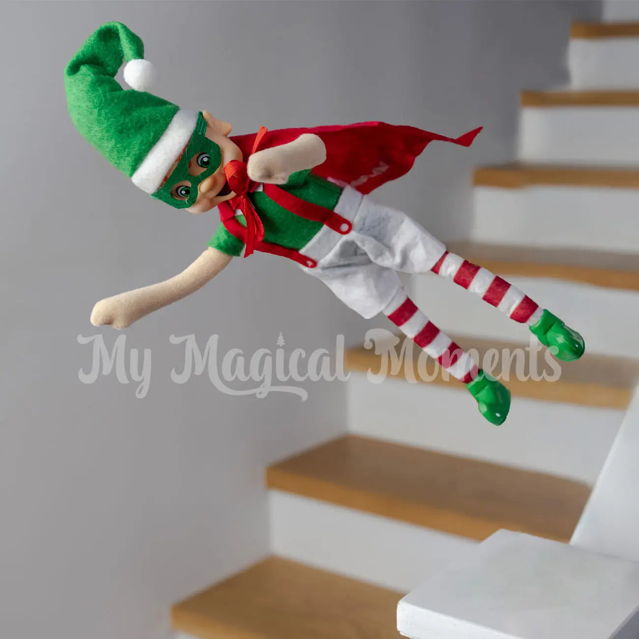elf jumping dressed as a superhero