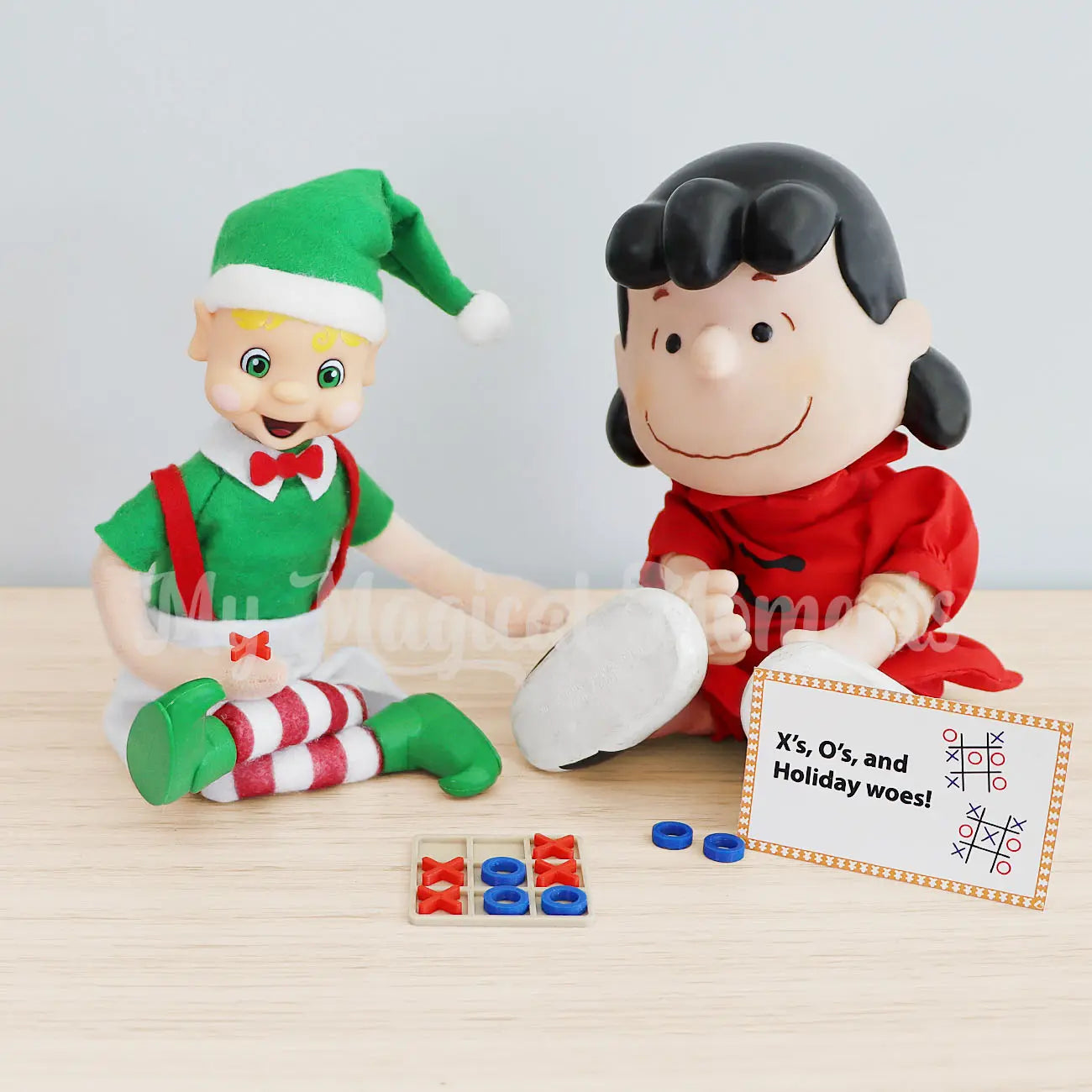 My Elf Friends Blonde hair Bendable Elf playing tic tac toe with a toy
