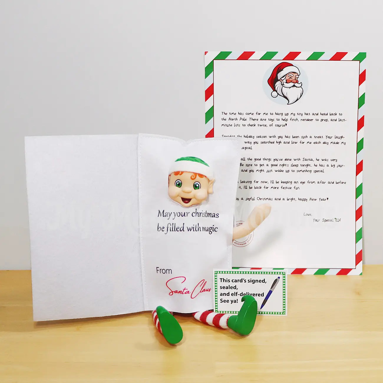 Elf wearing a Christmas Card Costume and a Free Elf Goodbye Letter
