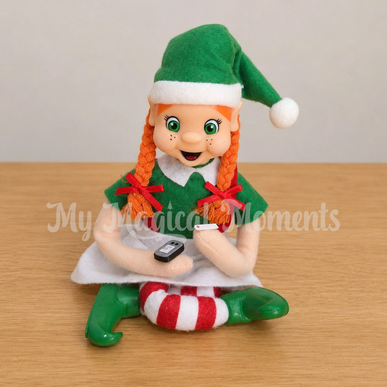 My Elf Friend with orange hair using her elf sized glucometer prop