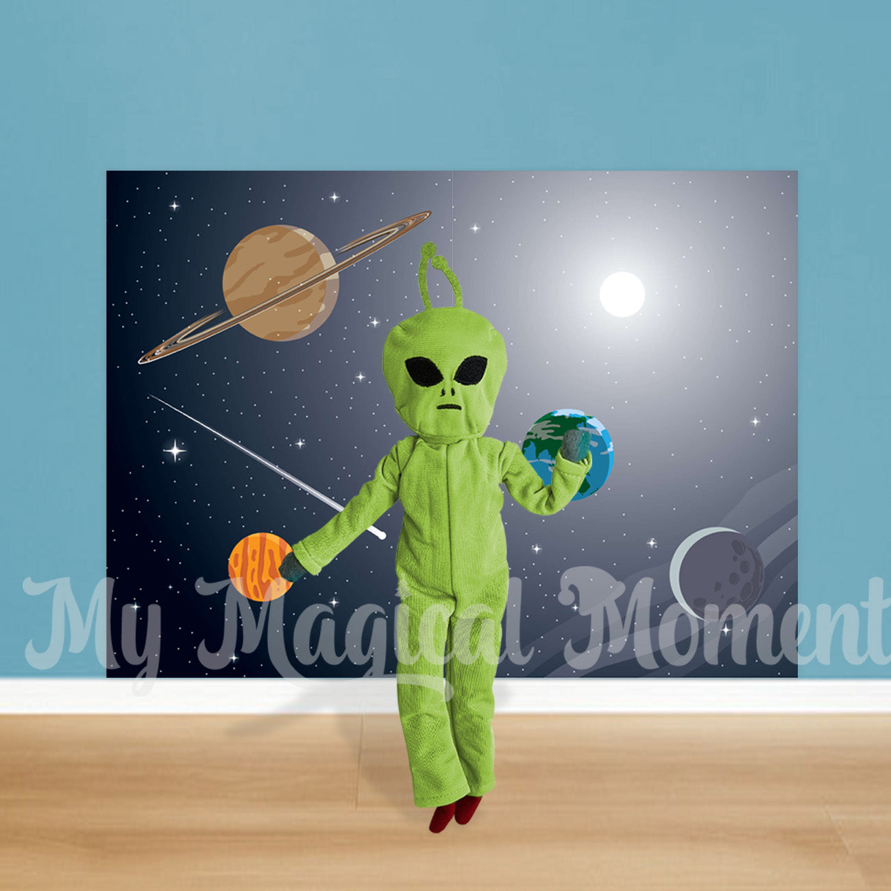 Elf wearing an alien costume in front of a space scene printable