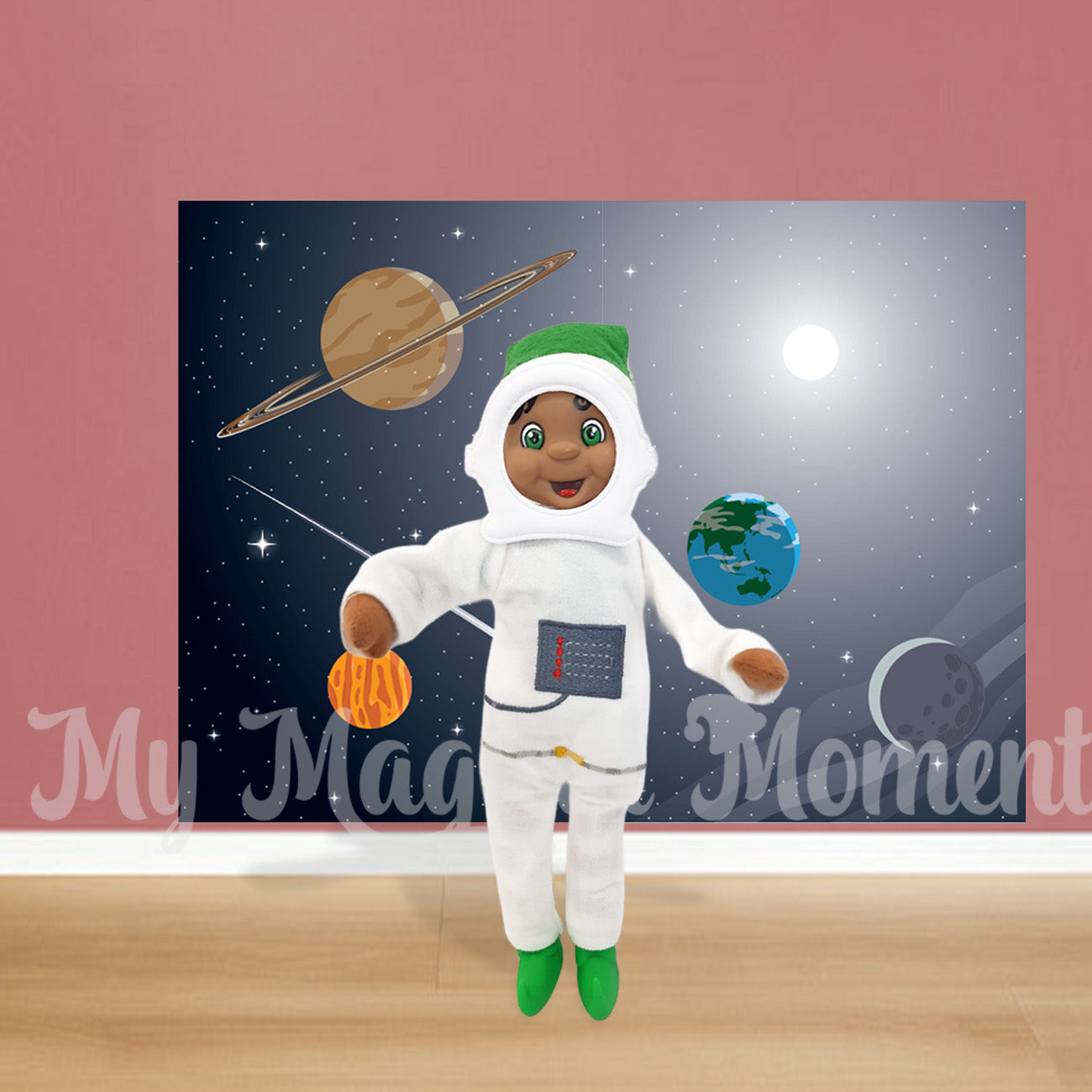 Elf wearing an astronaut costume in front of a space scene printable